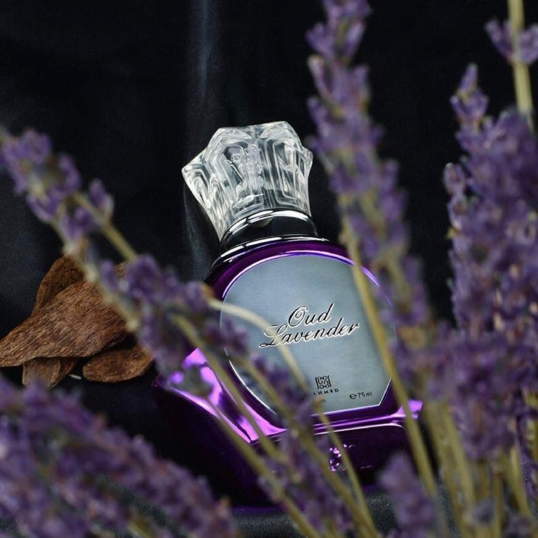 Perfume bottle labeled 'Oud Lavender' surrounded by lavender flowers on a dark background