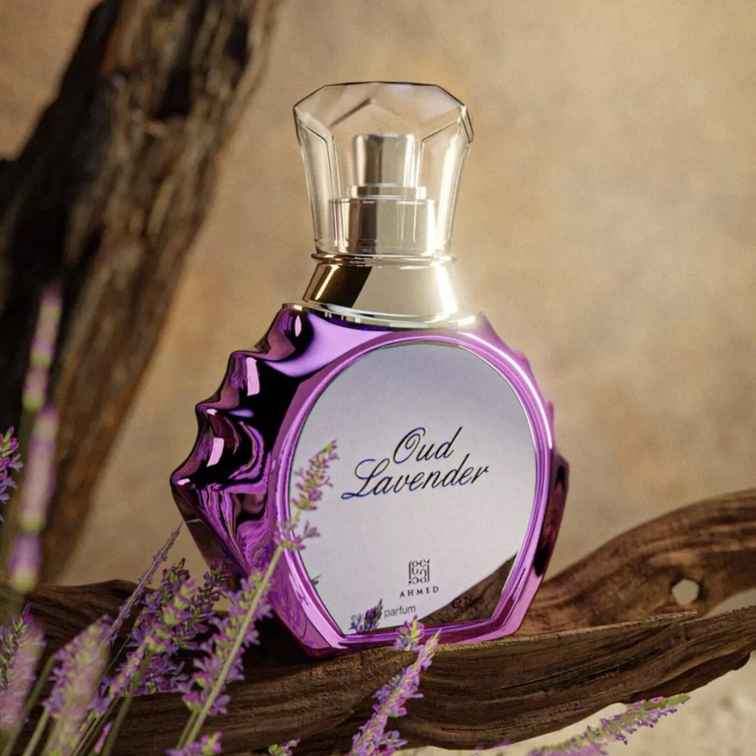 Perfume bottle labeled 'Oud Lavender' on a wooden surface with lavender flowers.