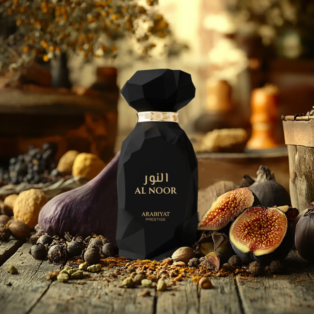 Perfume bottle labeled 'Al Noor' surrounded by fruits and spices on a wooden surface. Al Noor by Arabiyat Prestige Unisex Perfume