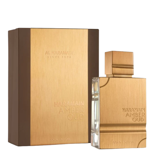 Haramain Amber Oud perfume bottle and packaging on a white background. Amber Oud Gold Edition by Al Haramain Unisex Perfume