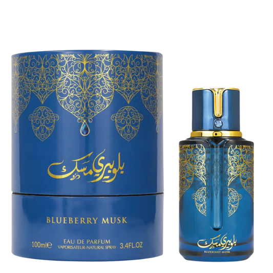 Blueberry Musk Eau de Parfum bottle by Arabiyat Prestige with gold details beside matching blue and gold cylindrical packaging, premium Arabian perfume for men and women.