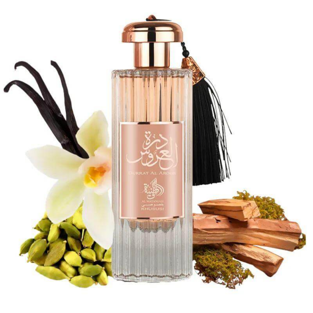Perfume bottle with vanilla bean, orchid, wood, and cardamom on a white background. Durratul Uroos by LXR Womens Perfume
