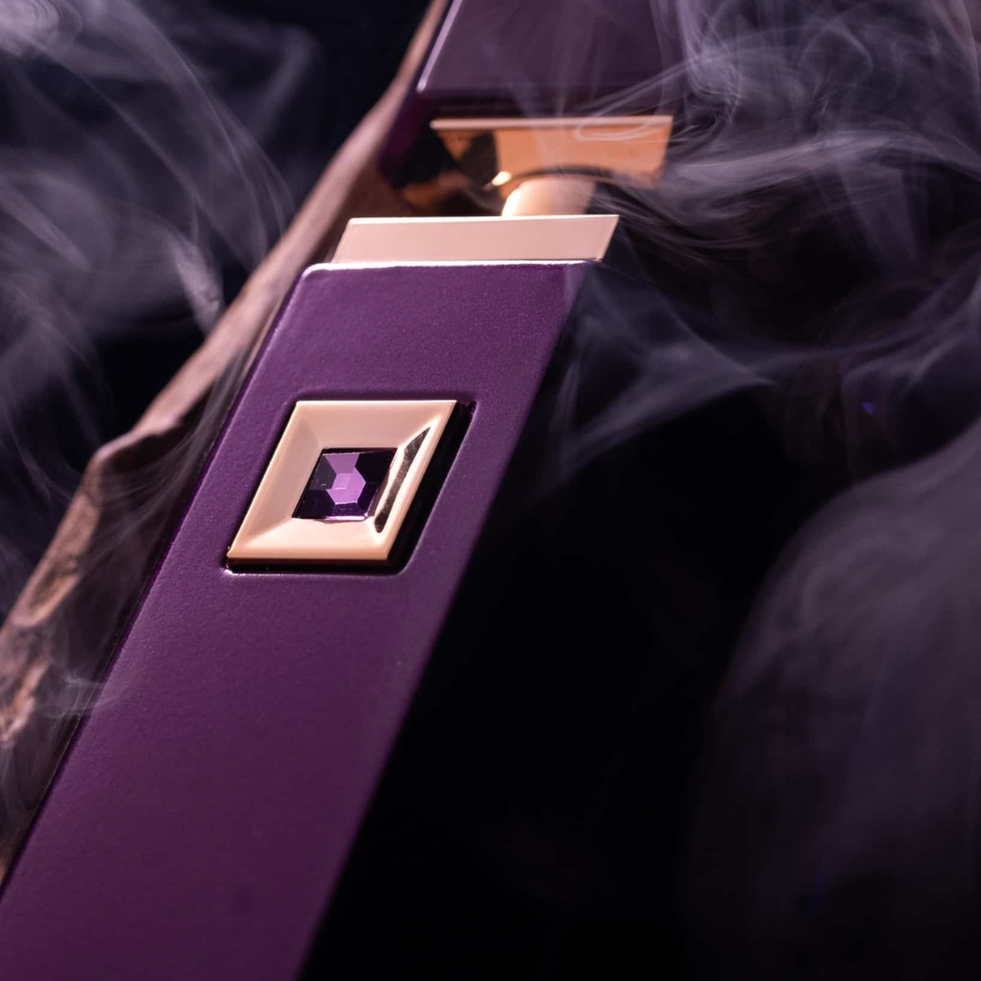 Purple and gold perfume bottle with smoke effect