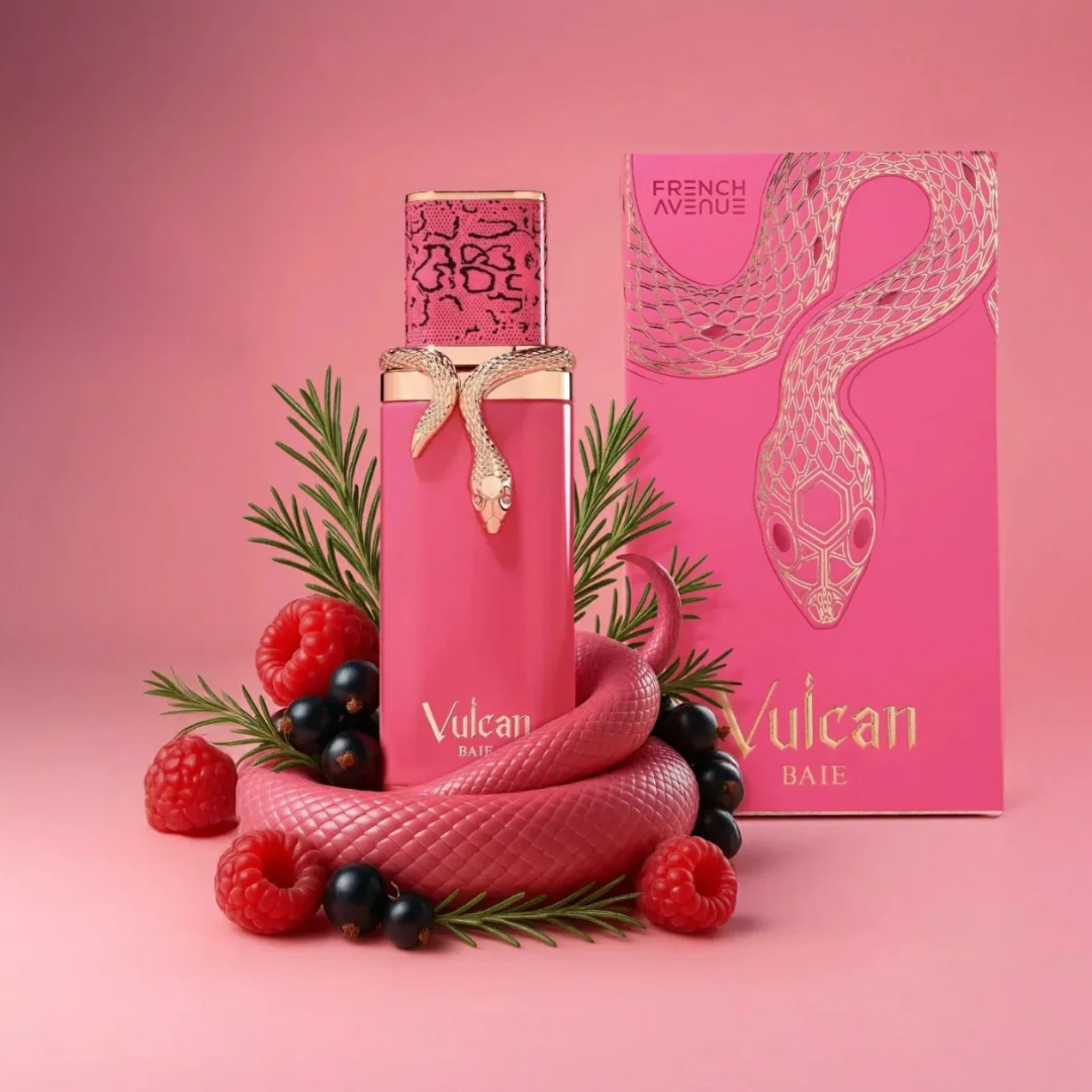 Pink perfume bottle and packaging with berries and leaves on a pink background