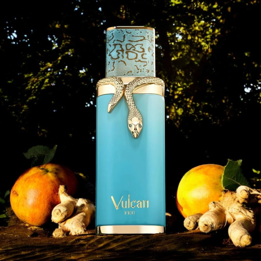 Blue perfume bottle with snake design labeled 'Vulcan' on a dark background with fruits and leaves.