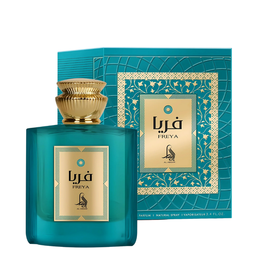 Teal Freya perfume bottle and packaging with gold accents on a white background