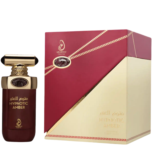 Perfume bottle with red and gold packaging on a white background. Hypnotic Amber by Arabiyat Prestige Unisex Perfume