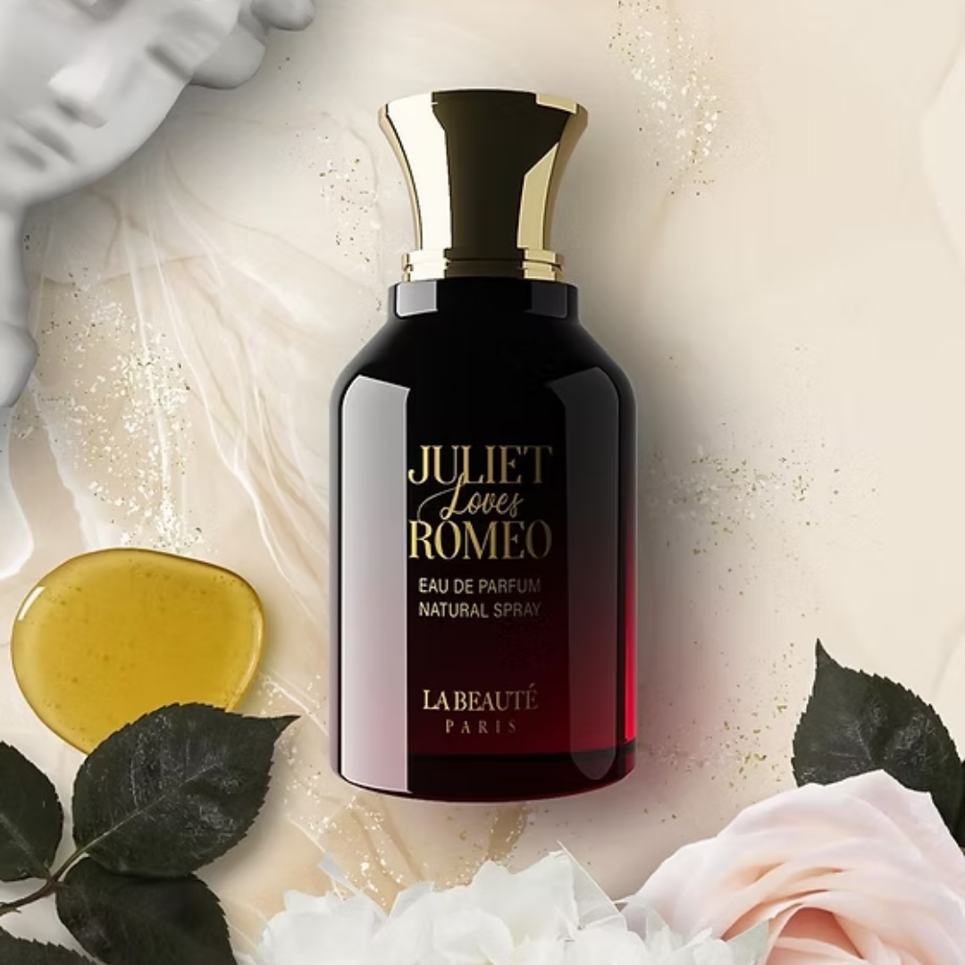 Perfume bottle labeled 'Juliet Loves Romeo' by La Beaute Paris with decorative elements like flowers and leaves.