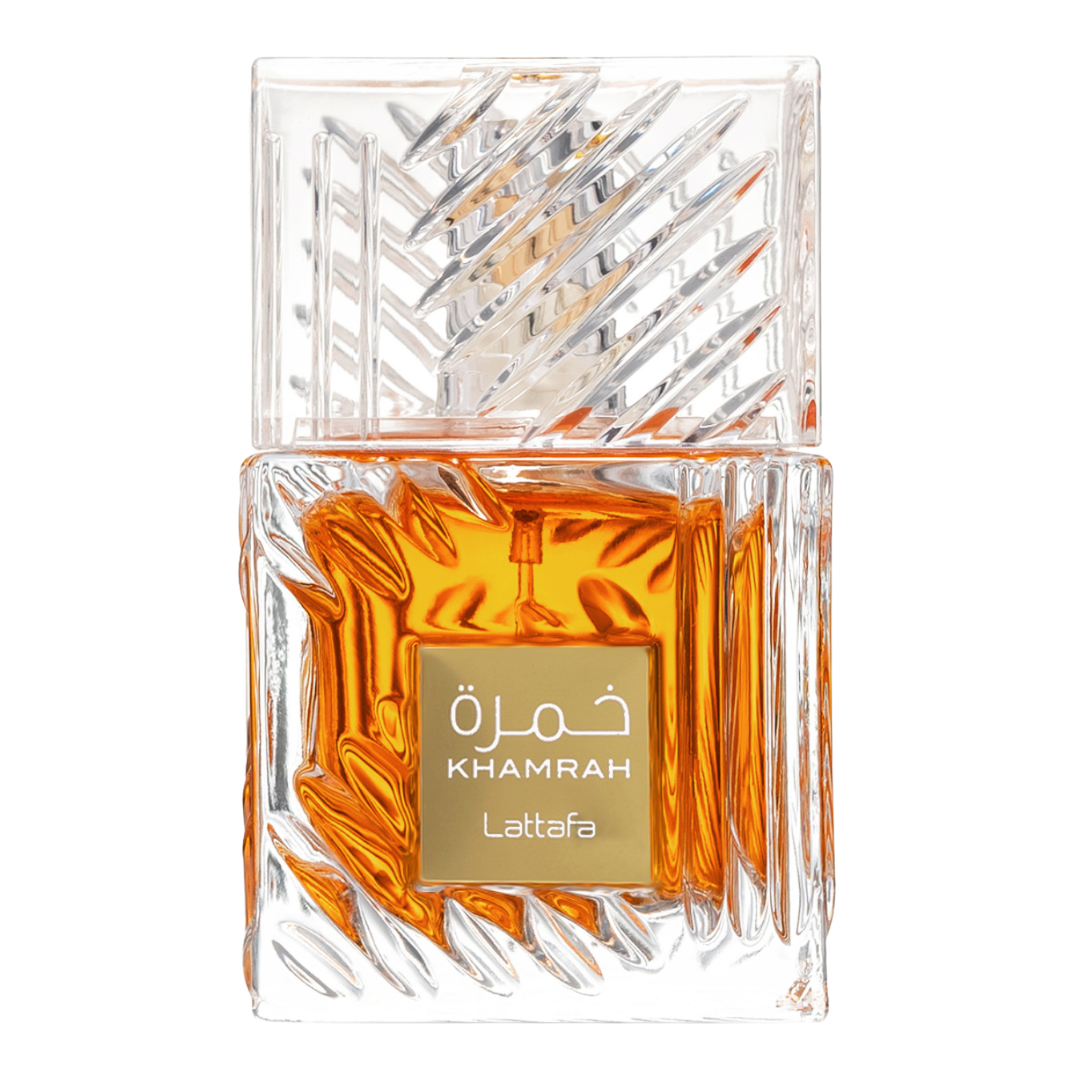 A luxurious crystal bottle of Khamrah unisex fragrance by Lattafa, displaying the amber-colored perfume liquid. Clone / dupe of / inspired by Killian - Angels' Share luxury perfume. Close-Up of Lattafa Khamrah Perfume Bottle – Detailed view of the premium crystal-cut glass bottle with rich amber liquid and gold label, representing luxury oriental gourmand scents.