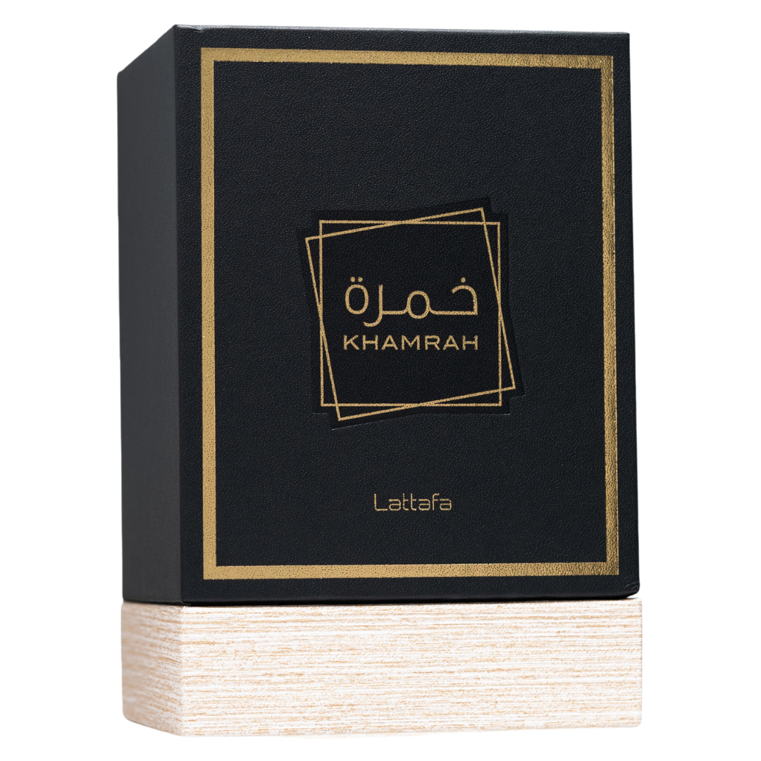 Clone / dupe of / inspired by Killian - Angels' Share unisex perfume. Lattafa Khamrah Premium Perfume Packaging – Stylish black and gold perfume box with textured wooden base, highlighting a high-end Middle Eastern fragrance presentation.
