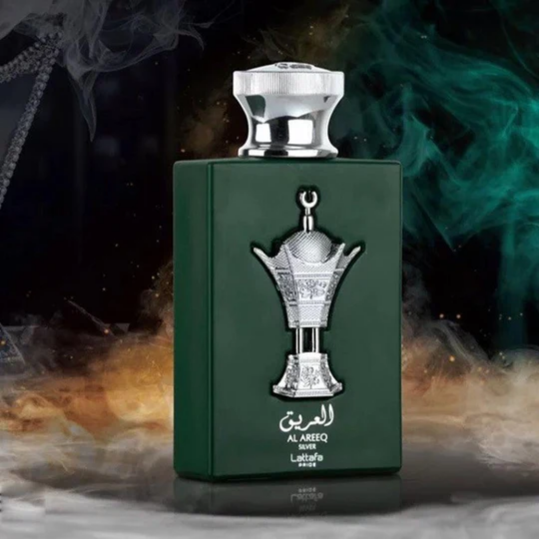 Green perfume bottle with silver cap on a dark background. Lattafa Al Areeq Silver Unisex Perfume