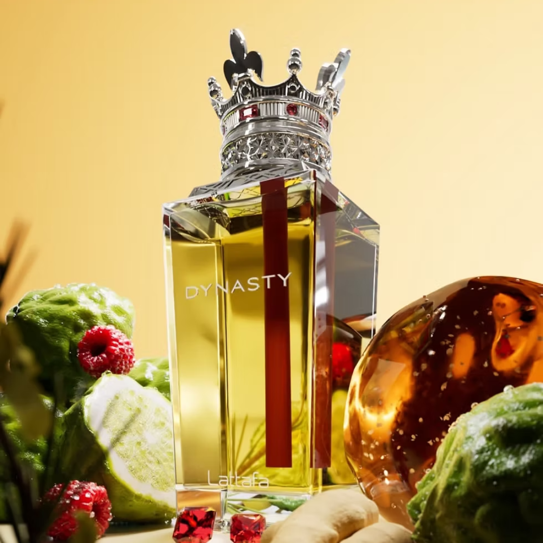 Perfume bottle labeled 'Dynasty' with decorative elements on a yellow background. Lattafa Perfumes Dynasty Unisex Perfume.