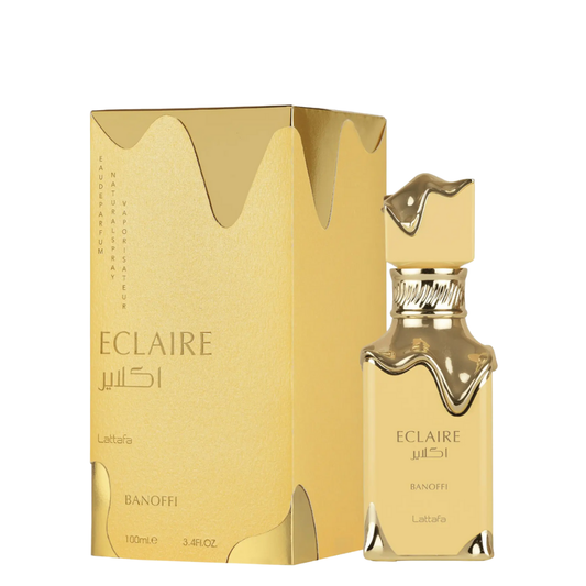 Gold Eclaire perfume bottle and packaging on a white background. Lattafa Eclaire Banoffi Unisex Perfume