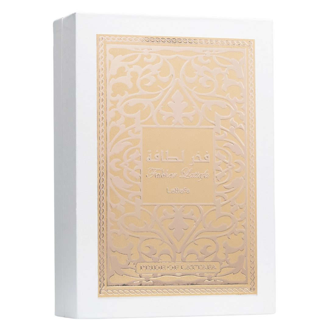 Lattafa Fakhar perfume box in elegant white with embossed gold Arabic pattern and calligraphy, symbolizing luxury Middle Eastern perfumery. Clone / dupe of / inspired by Givenchy - L’Interdit perfume.