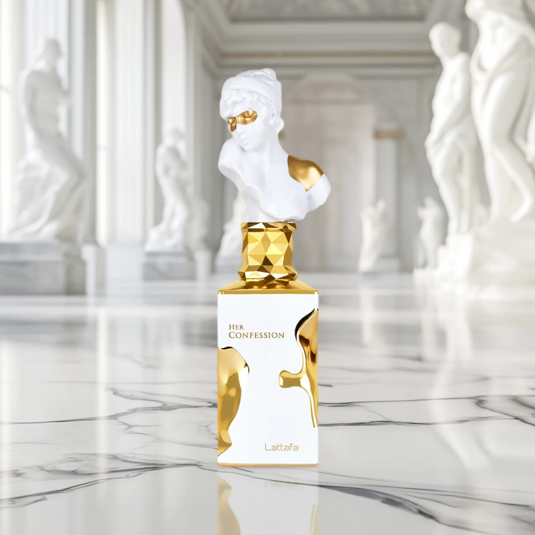 Perfume bottle labeled 'Her Confession' by Lattafa Perfumes in a marble setting
