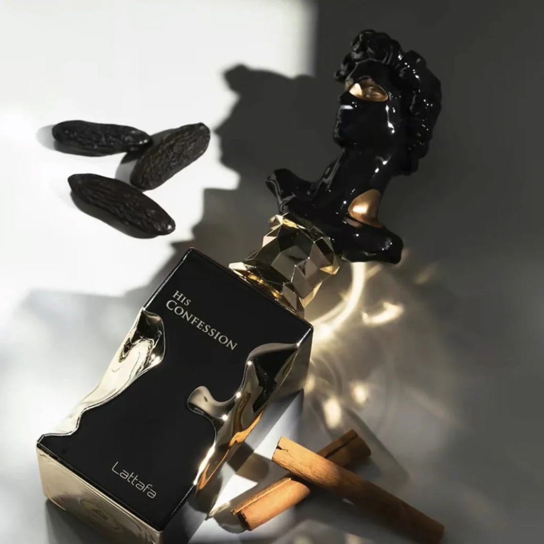 Perfume bottle labeled 'His Confession' by Lattafa with black almonds and cinnamon sticks on a light background. Lattafa His Confession Mens Perfume.