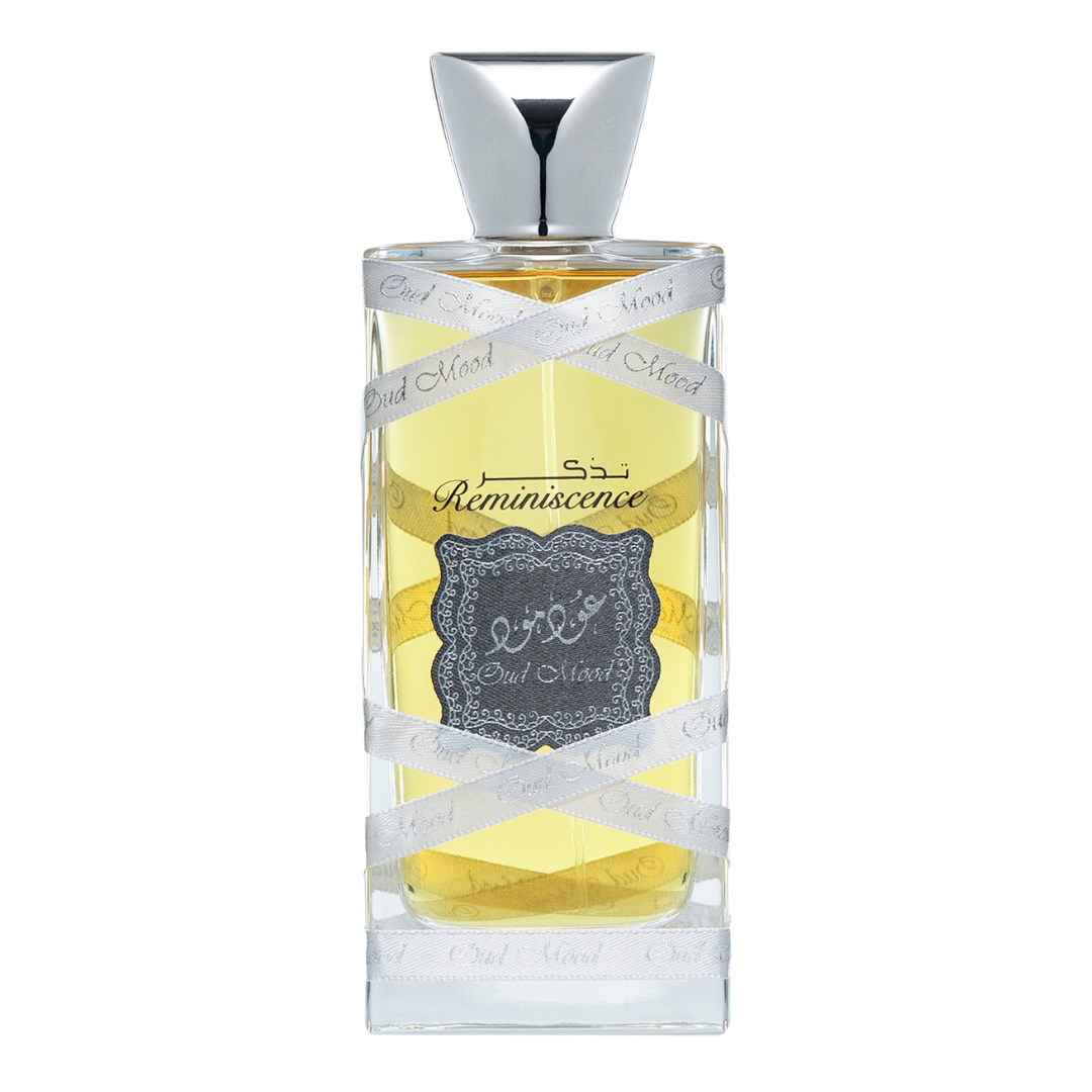 A bottle of Oud Mood Reminiscence Perfume with a clear, golden liquid visible and a label that reads 'Reminiscence' along with some decorative elements. Lattafa Oud Mood Reminiscence Unisex Perfume