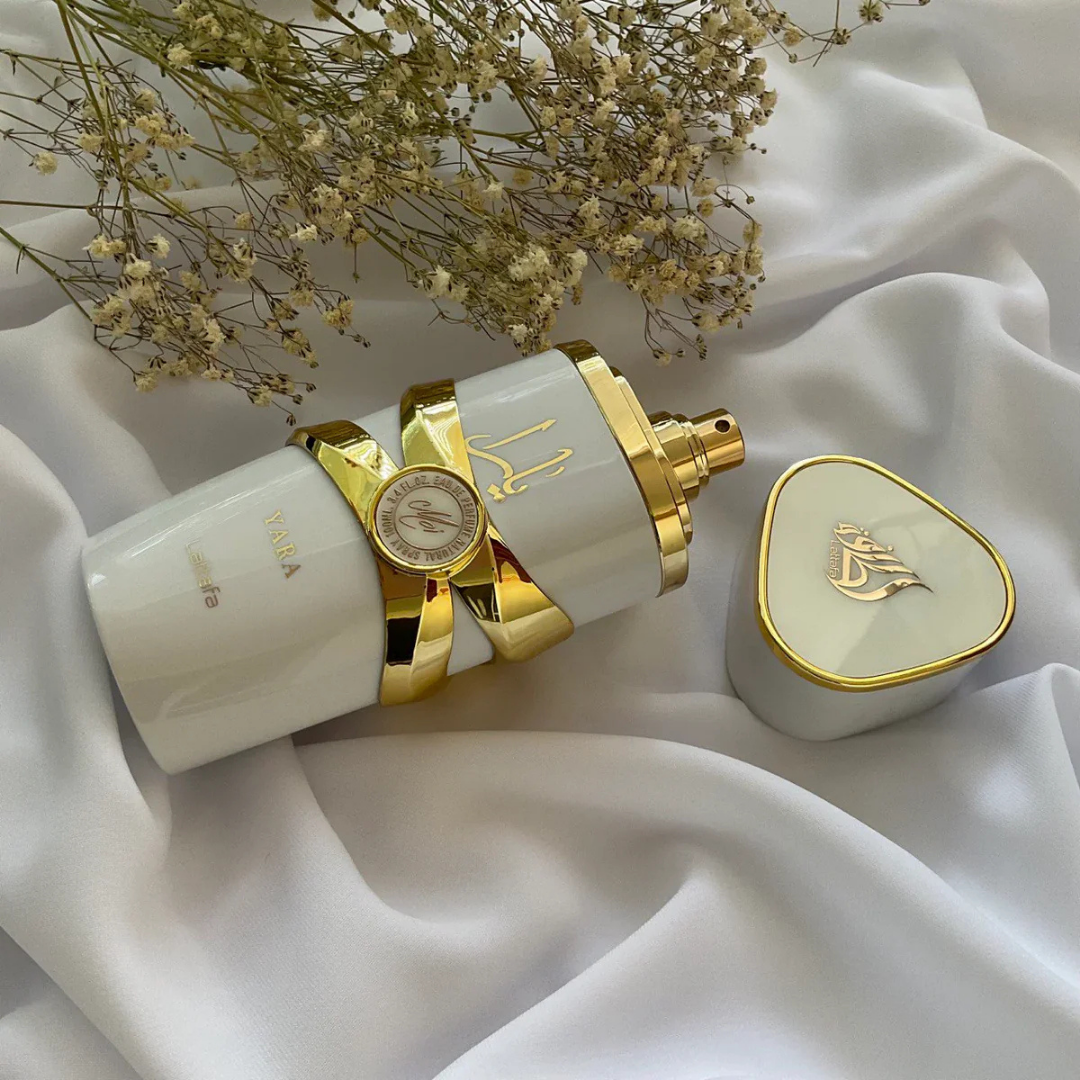 Lattafa Yara Moi Eau de Parfum bottle with cap removed on white satin – Luxurious Marc Jacobs Perfect alternative, sweet floral Arabian fragrance.