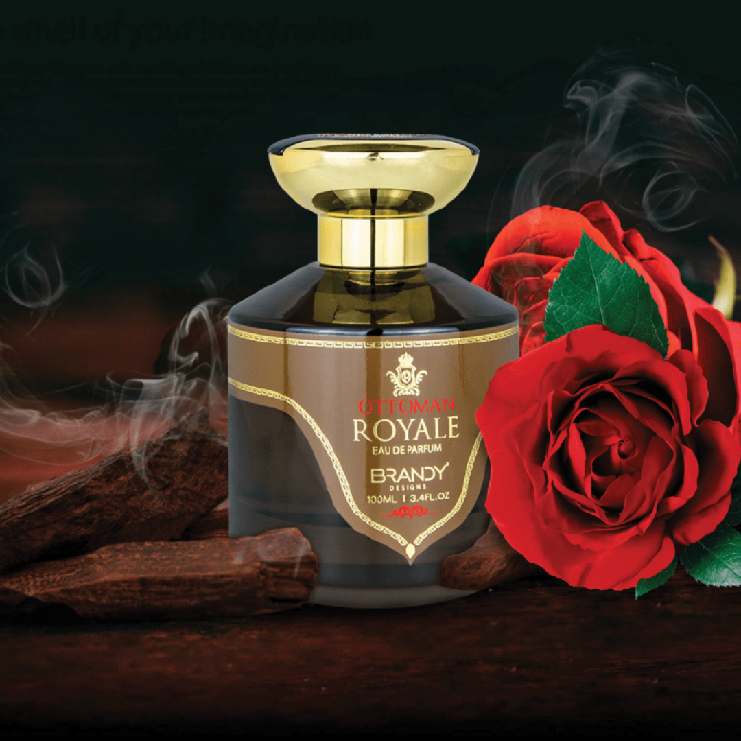 Brandy bottle labeled 'Ultimatum Royale' with a red rose and cinnamon sticks on a dark background. Ottoman Royale by Brandy Designs Unisex Perfume.