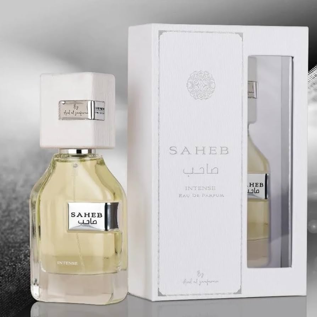 Saheb perfume bottle and packaging on a reflective surface. Ard Al Zaafaran. Clone / dupe of Imagination by Louis Vuitton.