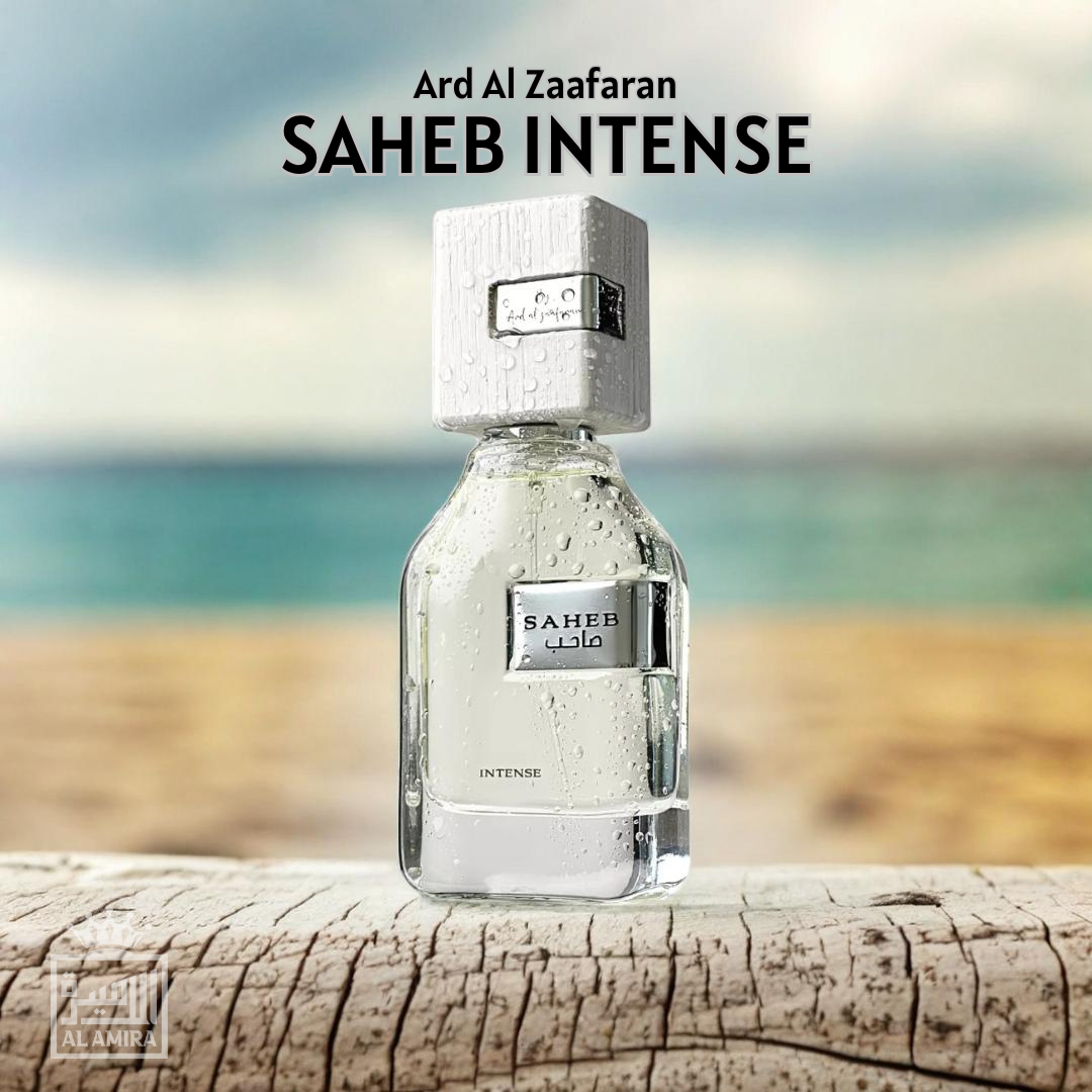 Perfume bottle labeled 'Saheb Intense' by Ard Al Zaaferan on a wooden surface with a blurred natural background. Ard Al Zaafaran. Clone / dupe of Imagination by Louis Vuitton.