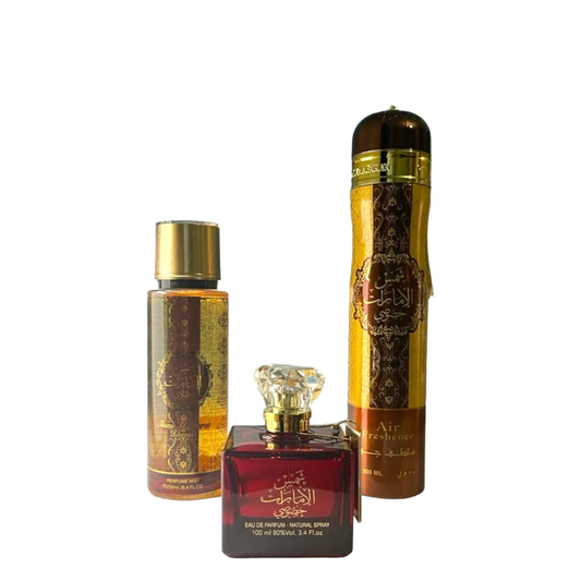 Three perfume bottles with gold and red design on a white background. Shams Al Emarat Khususi Giftset by Ard Al Zaafaran Womens Perfume