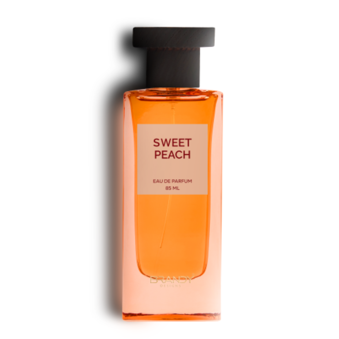 Sweet Peach Eau de Parfum 85ml bottle by Brandy Designs, featuring a peach-colored glass bottle with minimalist label and black cap. Clone / dupe of / inspired by Tom Ford - Bitter Peach.