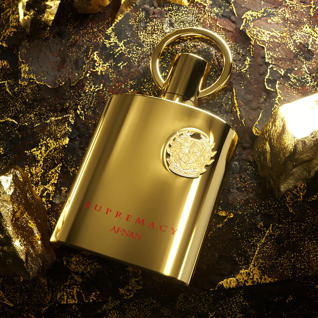 Gold bottle of Supremacy Gold by Afnan perfume on a textured dark surface