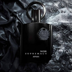 Black perfume bottle labeled 'Noir Supremacy' by Afnan on a textured dark background