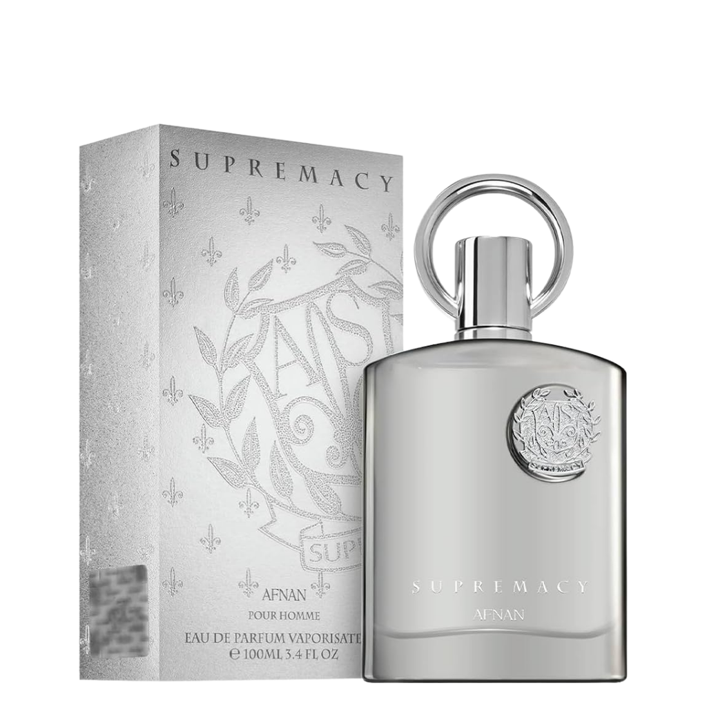 A bottle of AFNAN Supremacy Pour Homme eau de parfum next to its matching silver packaging box, featuring a metallic silver design with a ring cap and embossed branding.