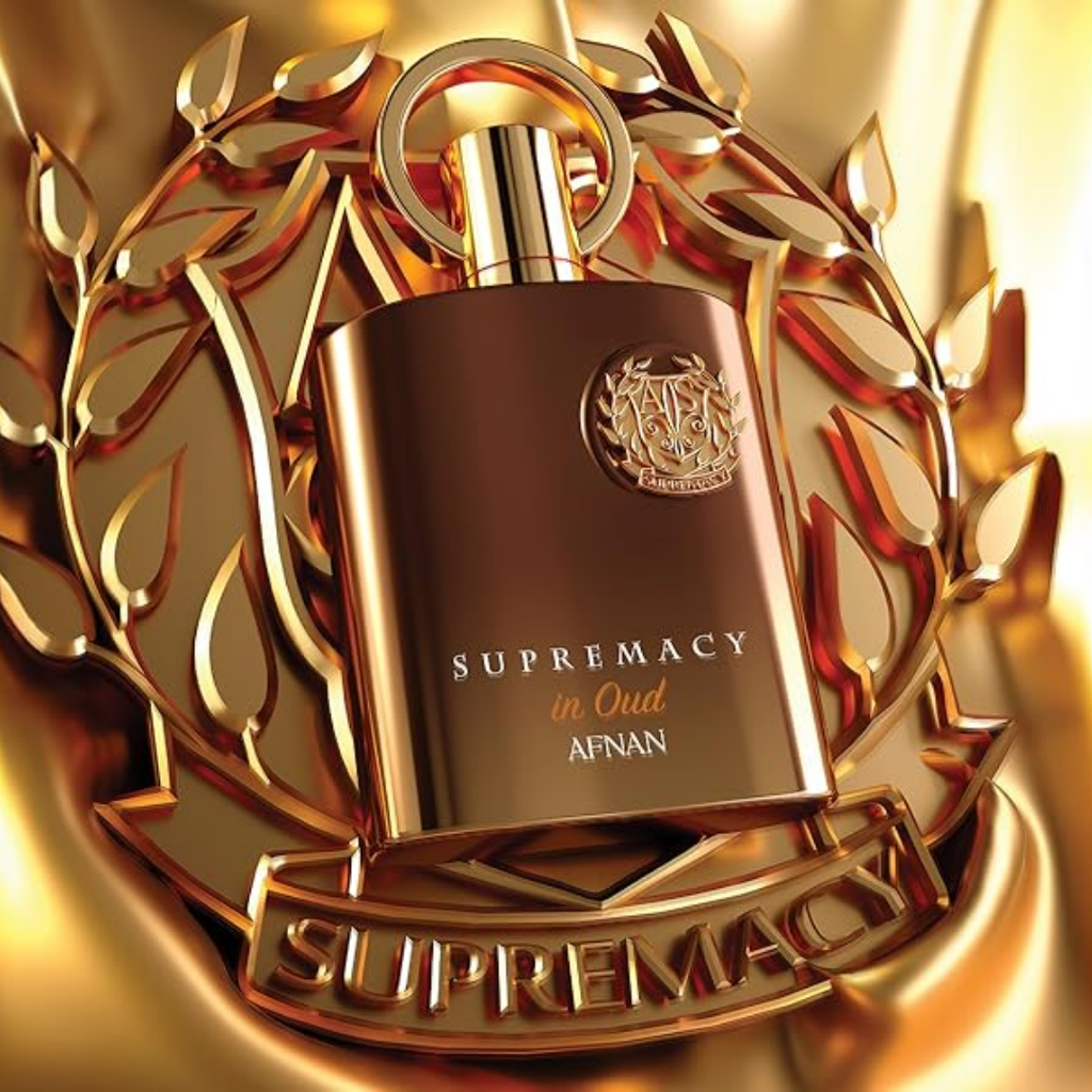 A metallic gold perfume bottle labeled 'SUPREMACY in Oud Afnan' centered on a matching gold laurel wreath and banner background.