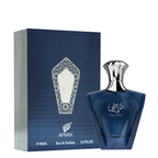 A bottle of Afnan Turathi Blue Eau de Parfum next to its blue packaging box, featuring a dark blue glass bottle with a silver cap and a matching blue box with a silver geometric emblem.