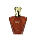 A bottle of Afnan Turathi Brown perfume with a faceted amber-brown glass body and a shiny gold cap, set against a plain white background.
