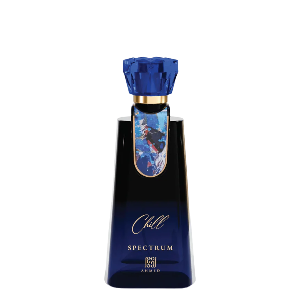 A dark blue glass bottle of Chill Spectrum by Ahmed, featuring a faceted blue cap, a gold collar, and a blue and white graphic label on the neck, set against a plain white background.