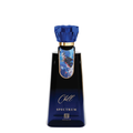 A dark blue glass bottle of Chill Spectrum by Ahmed, featuring a faceted blue cap, a gold collar, and a blue and white graphic label on the neck, set against a plain white background.