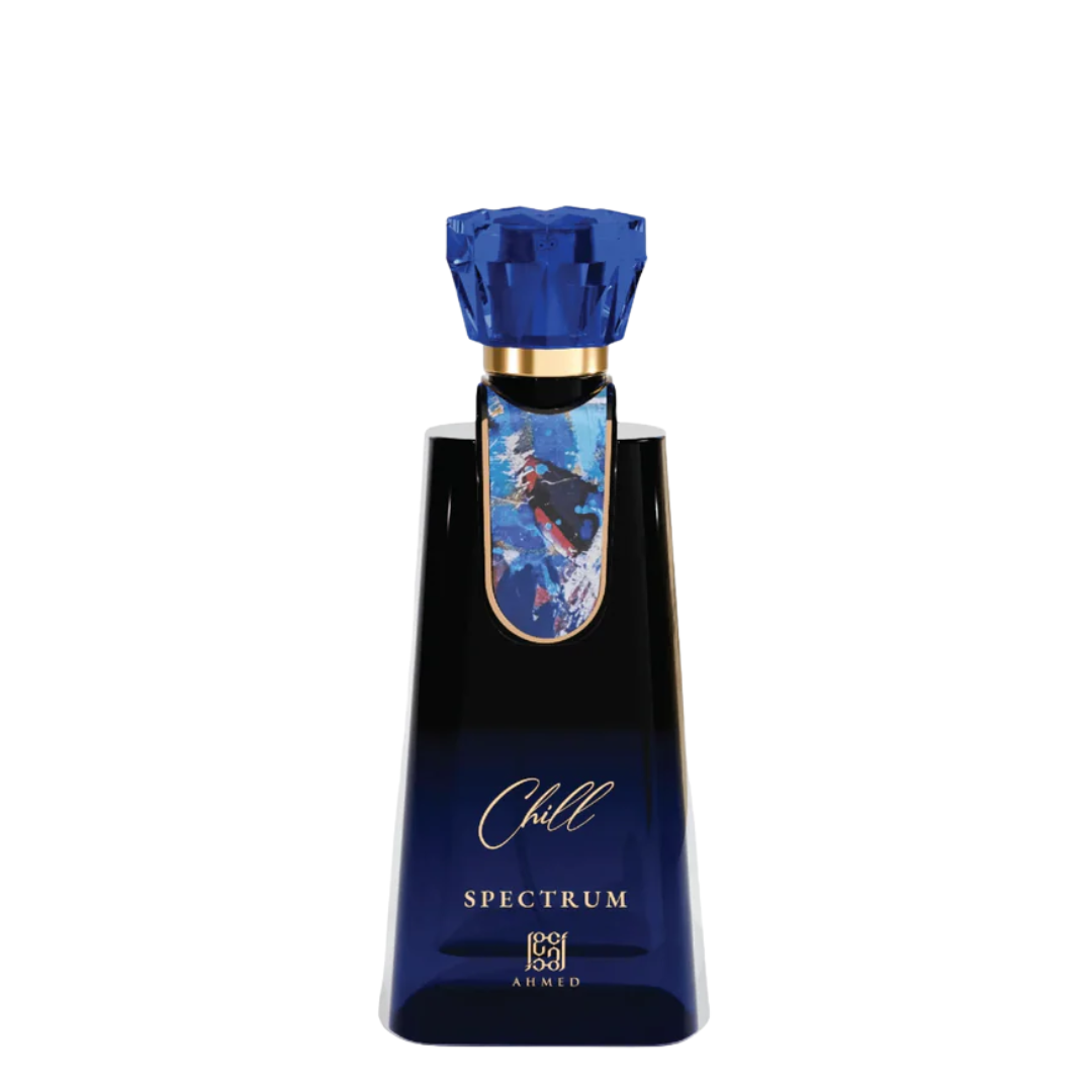 A dark blue glass bottle of Chill Spectrum by Ahmed, featuring a faceted blue cap, a gold collar, and a blue and white graphic label on the neck, set against a plain white background.