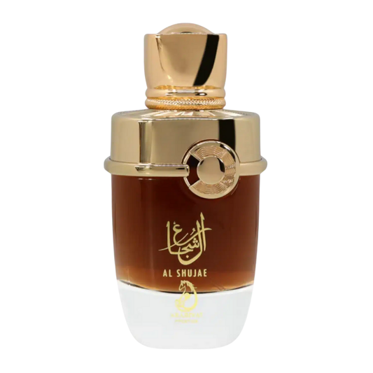 A luxurious perfume bottle with a gold-colored cap and a clear, amber-colored liquid visible. The label features Arabic calligraphy. Al Shujae by Arabiyat Prestige Unisex Perfume