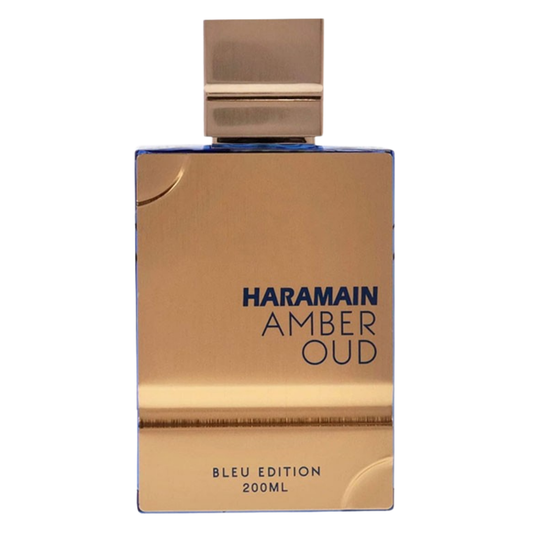 Gold perfume bottle with 'Haramain Amber Oud' text on a white background