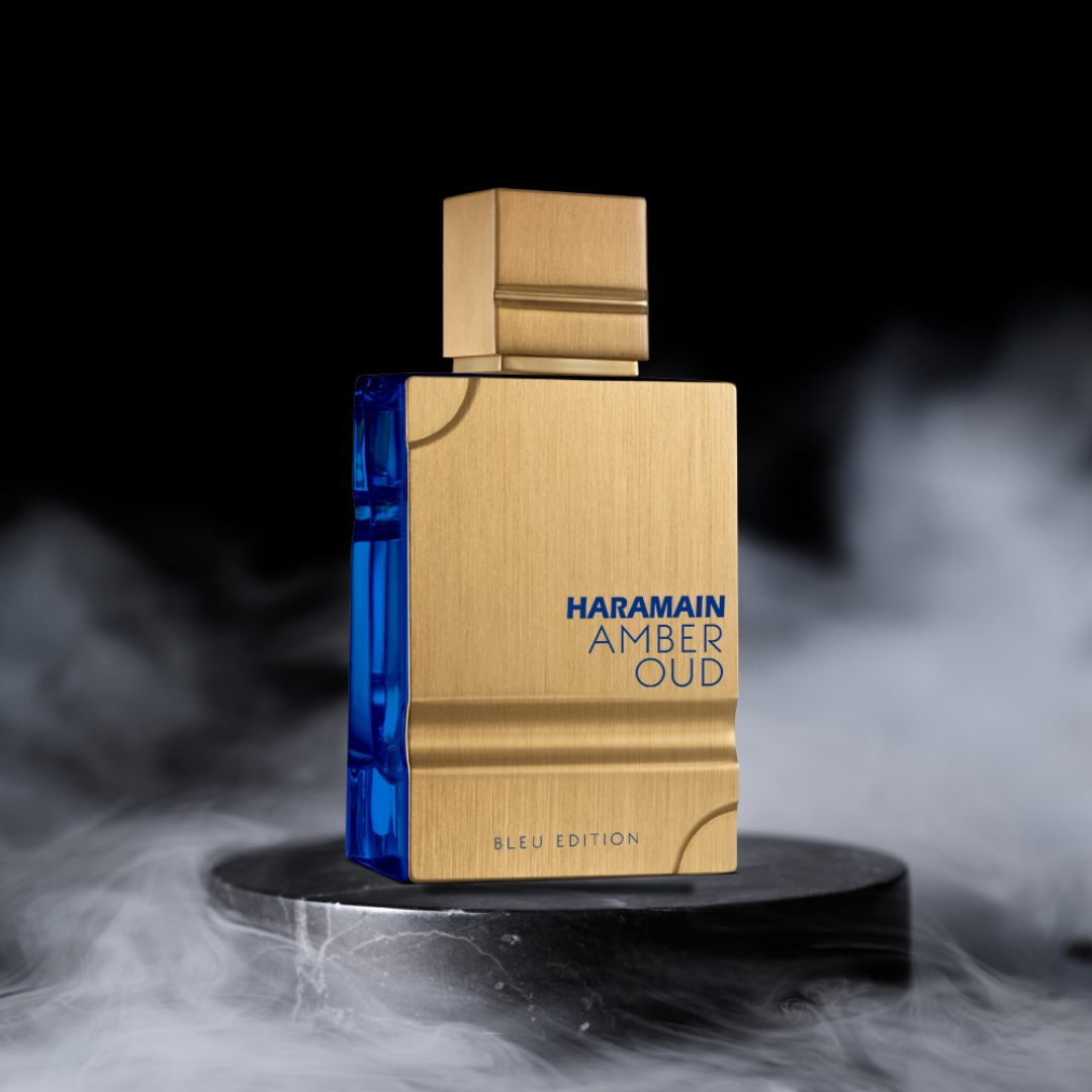 Haramain Amber Oud perfume bottle with gold and blue design on a dark background