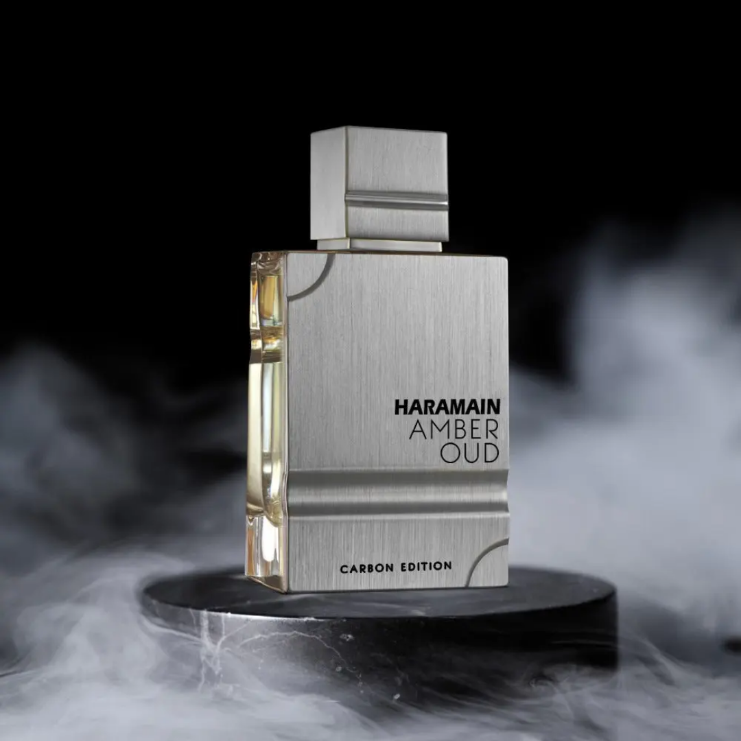 Haramain Amber Oud Carbon Edition perfume bottle on a dark background with smoke effects