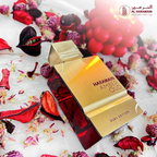 Haramain Amber Oud Ruby Edition perfume bottle on a floral background