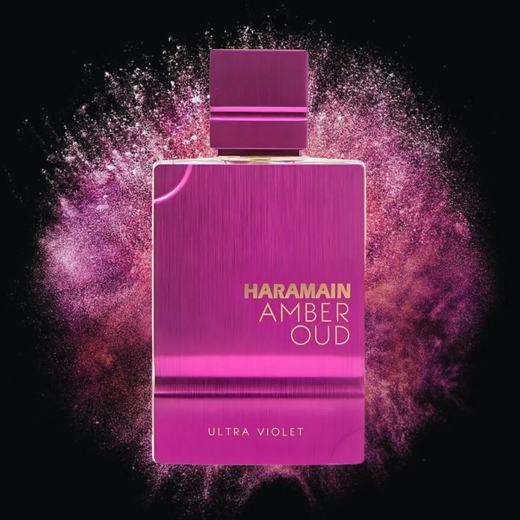 Haramain Amber Oud Ultra Violet perfume bottle with a pink and purple color scheme on a dark background.