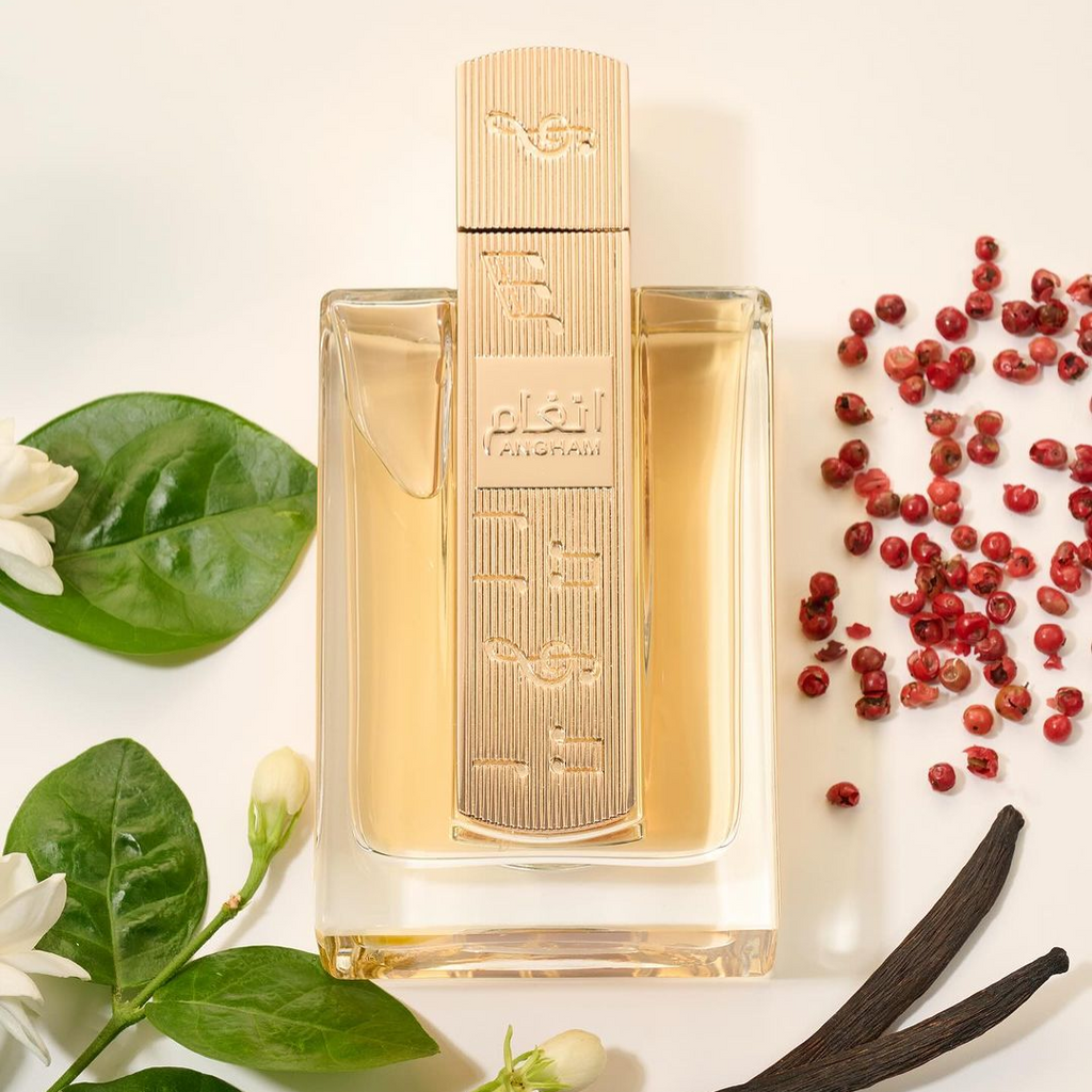 Perfume bottle with floral and spice elements on a light background. Angham by Lattafa 100ml perfume