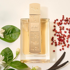 Perfume bottle with floral and spice elements on a light background. Angham by Lattafa 100ml perfume