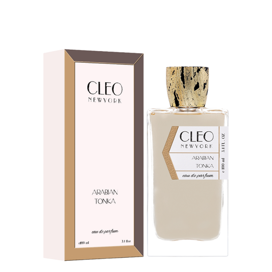 A perfume bottle with the label 'Cleo' on it, next to its packaging box. The perfume bottle is clear with a gold cap, and the box is beige with the product name 'Arabian Tonka'.