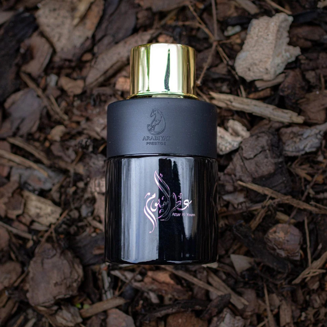 Attar Al Youm by Arabiyat Prestige – 100ml luxury Arabian perfume bottle on natural wood background | warm, earthy, unisex scent. Clone / dupe of / inspired by Yves Saint Laurent - Yvresse (Champagne) YSL.