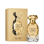 Arabiyat Prestige Mahd Al Dhahab Extrait de Parfum bottle and its gold-colored packaging box, featuring a faceted geometric design on a white background.