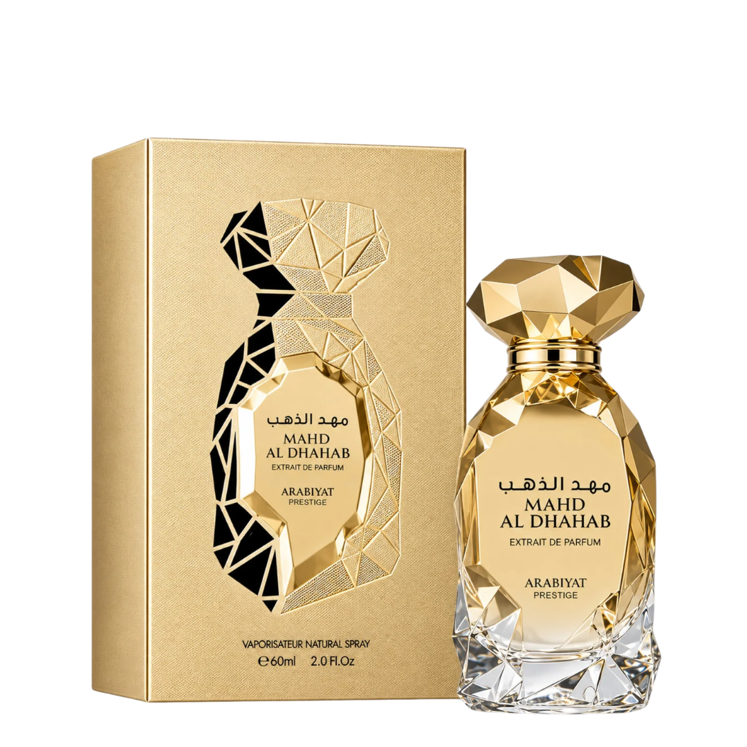 Arabiyat Prestige Mahd Al Dhahab Extrait de Parfum bottle and its gold-colored packaging box, featuring a faceted geometric design on a white background.