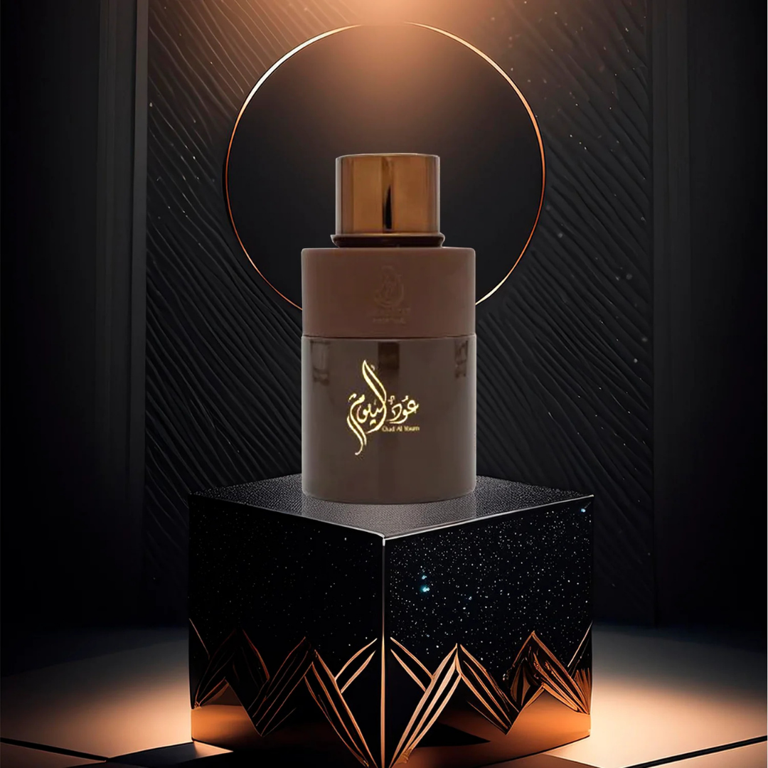Oud Al Youm by Arabiyat Prestige – luxurious 100ml oud perfume bottle on starry black display with golden light | intense oriental scent for men and women. Clone / dupe of / inspired by Initio - Oud for Greatness.