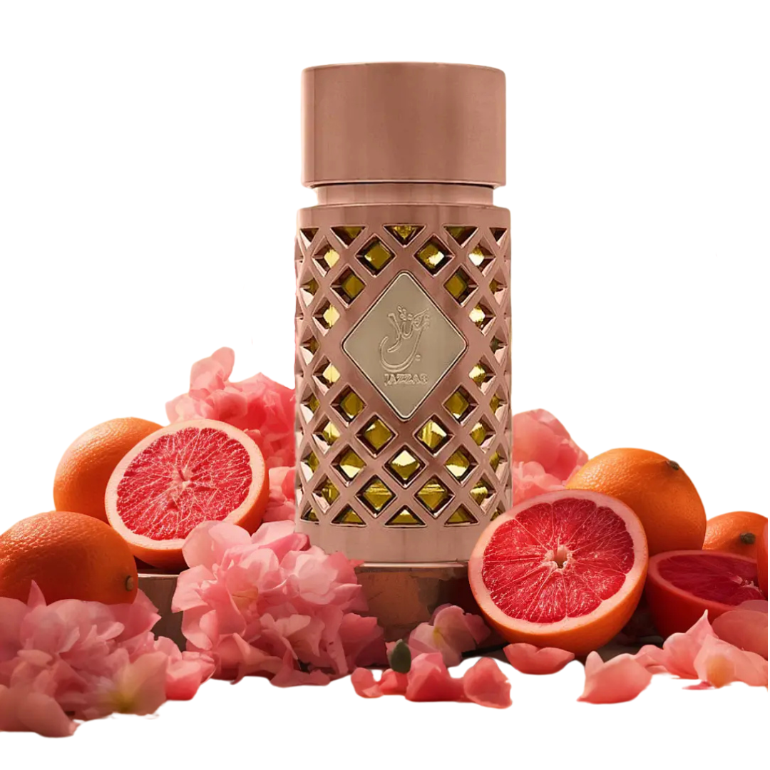Jazzab Eau long lasting perfumes bottle surrounded by fresh grapefruit, oranges, and pink flowers – fruity floral fragrance concept.